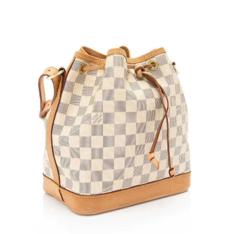 Louis Vuitton Twist bags with a contrast - colored interior for visual interestLouis Vuitton Damier Azur Noe BB Bucket Bag (rk9lnv)