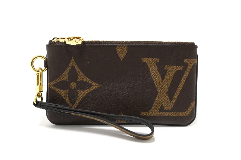 Ladies Louis Vuitton Capucines bags with a detachable shoulder strapAuthentic Louis Vuitton Giant Monogram Reverse Trio Rectangle Wristlet Pouch