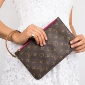 Louis Vuitton handbags with a back - zip pocket for storing valuablesLouis Vuitton Monogram Wristlet