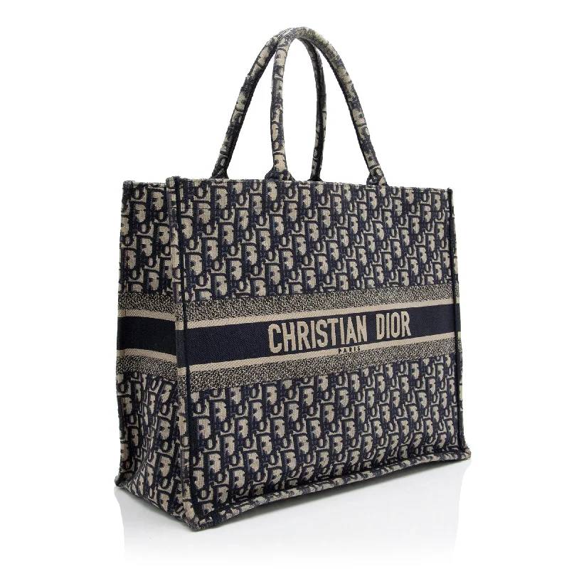 Christian Dior bags with a side - pocket for holding a water bottleChristian Dior Oblique Book Tote