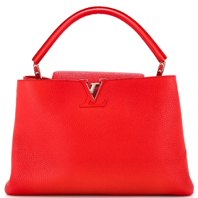 Louis Vuitton Twist bags with a crystal - embellished LV - turnlockCapucines Bag Leather GM